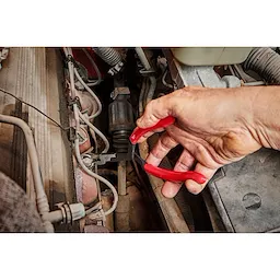 Worker using the long reach hose grip pliers