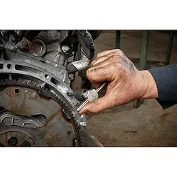 Worker using the Tap Collet for Taps up to 1/2” & T Handle Bar