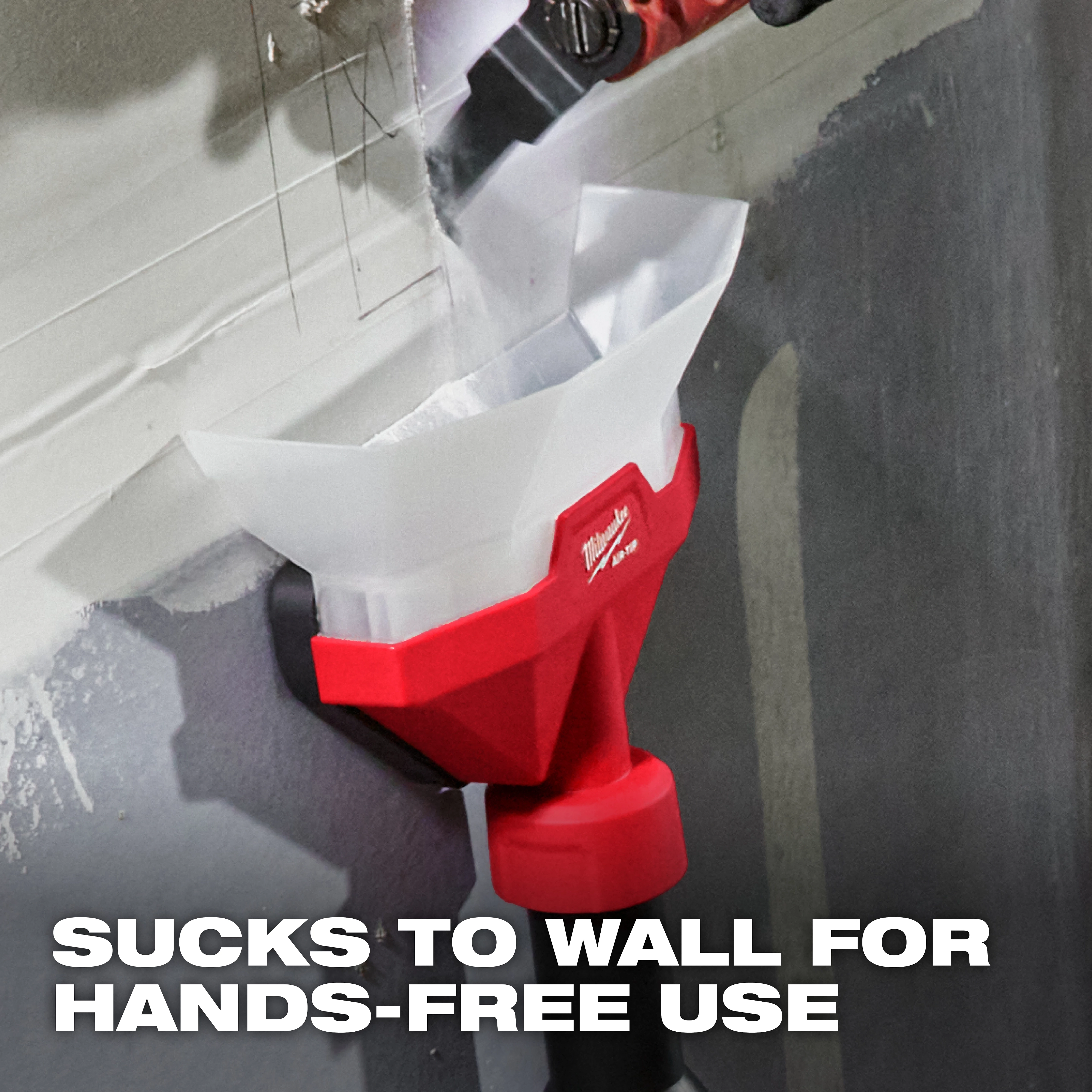 The image shows an AIR-TIP™ Dust Collector in use. It is attached to a wall and collecting dust hands-free. The red and white device has the Milwaukee logo and is actively suctioning dust while a tool works above it. Text on the image reads, "SUCKS TO WALL FOR HANDS-FREE USE."