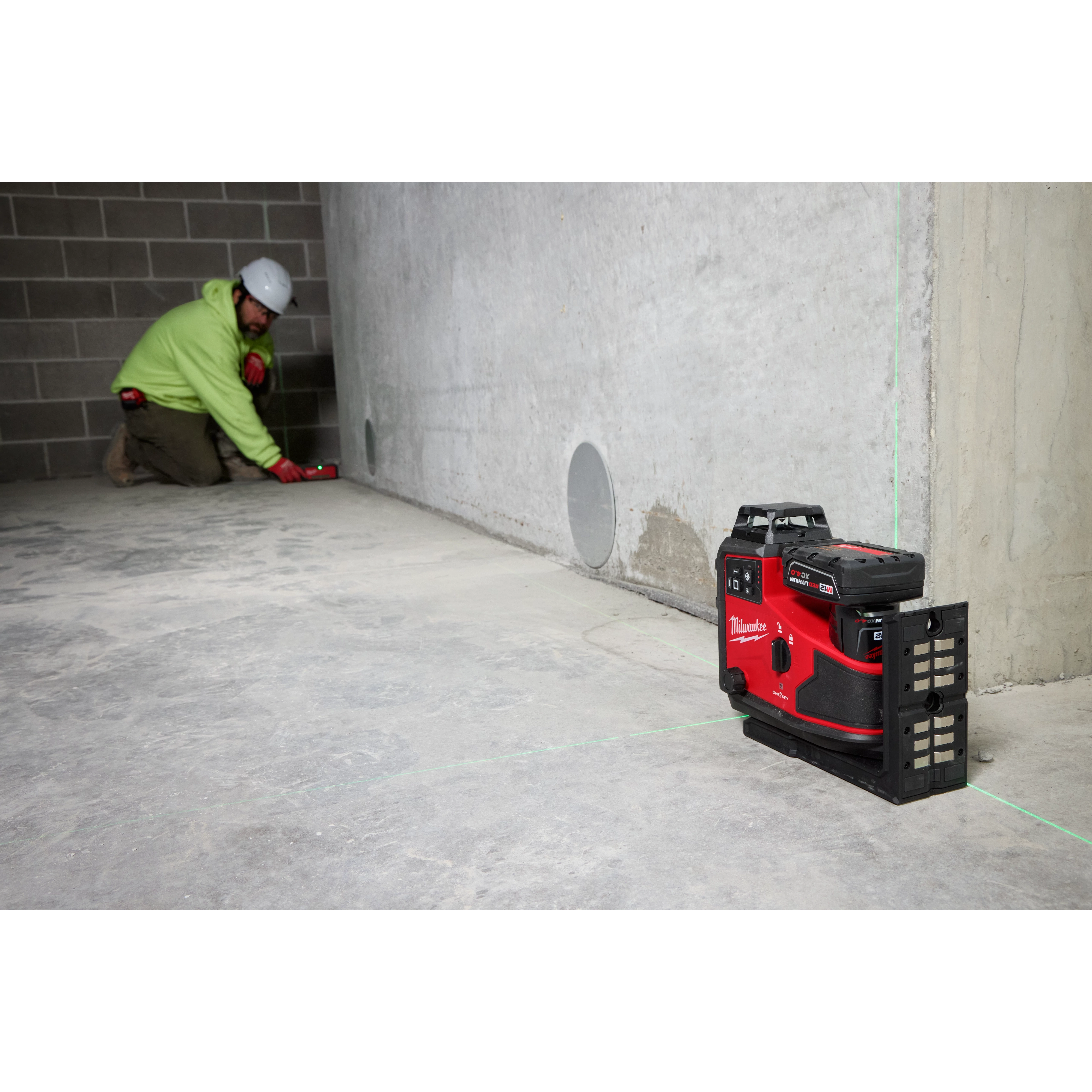 Image of the M12™ Green 360° 3-Plane Laser w/Automatic Alignment & Receiver being used on the jobsite