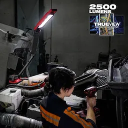 Image of a mechanic using the Milwaukee M18 Magnetic Extendable Boom Light on the jobsite