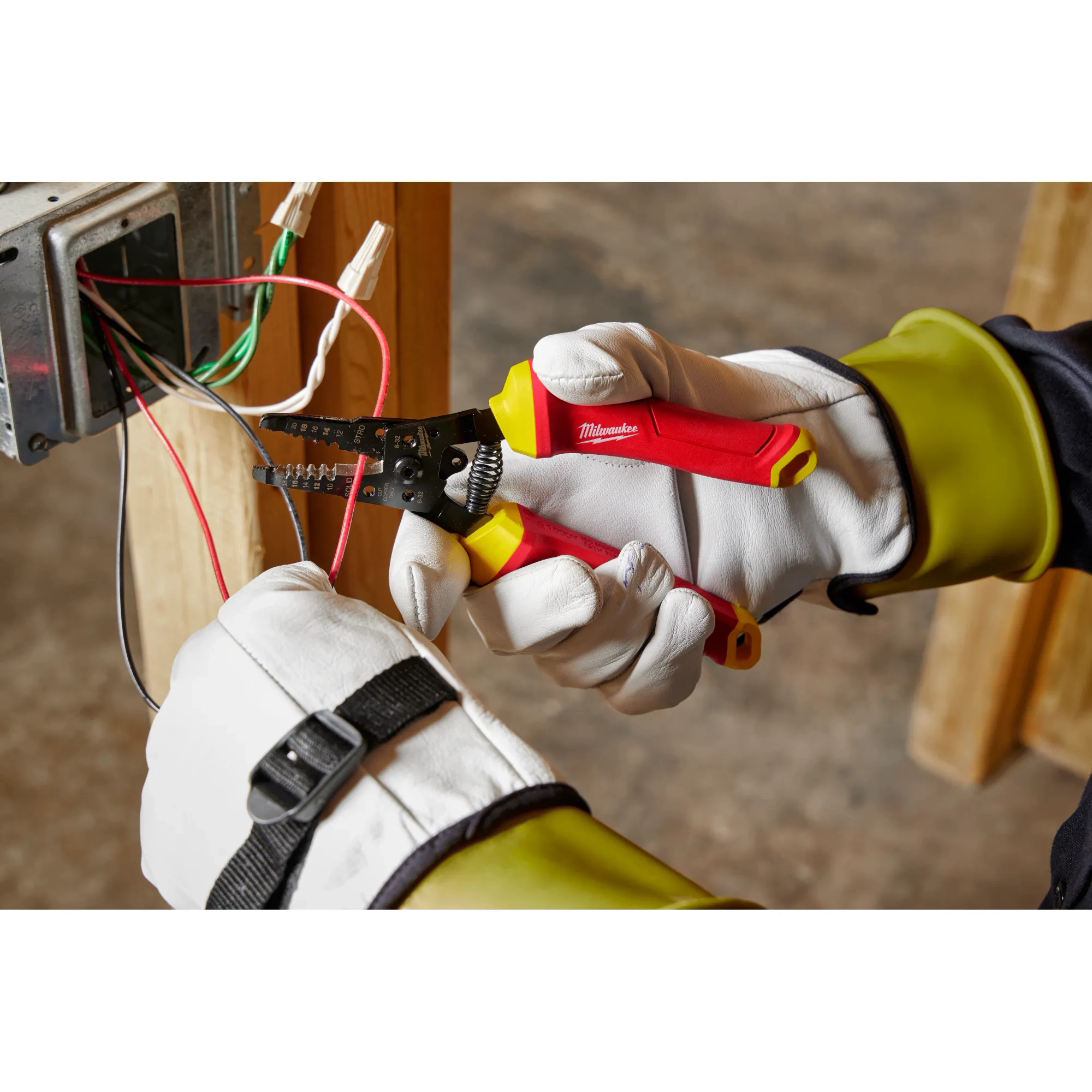 Image of the Milwaukee 1000V Insulated 10-20 AWG Wire Stripper & Cutter being used by an electrician