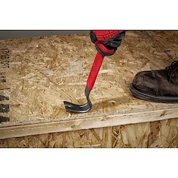 Worker using the pry bar to remove a nail 