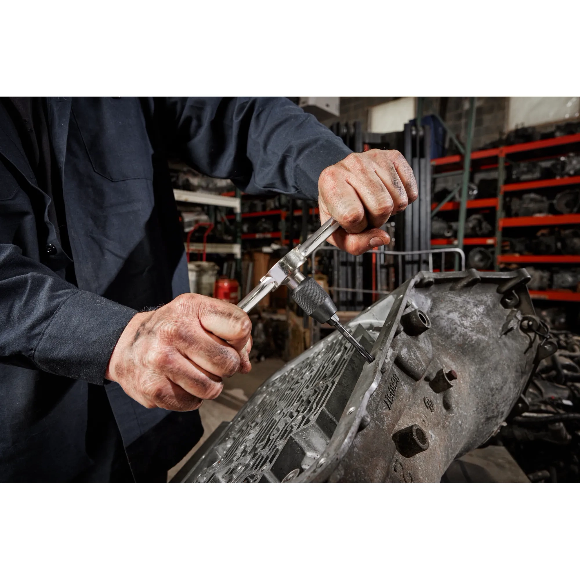 Worker using the Hex-LOK™ 2-in-1 Tap and Die Threading Handle​ & Tap Collet