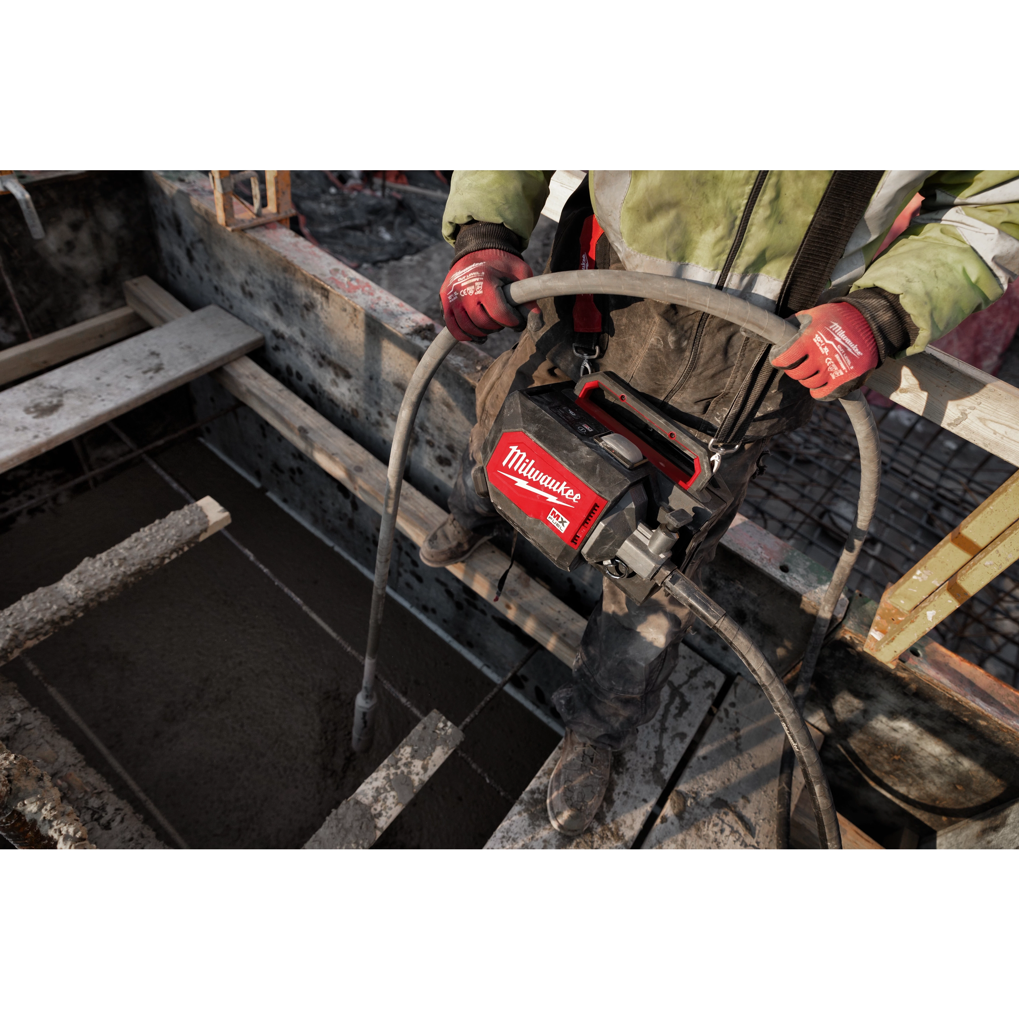 Worker using the MX Fuel Concrete Vibrator on the jobsite