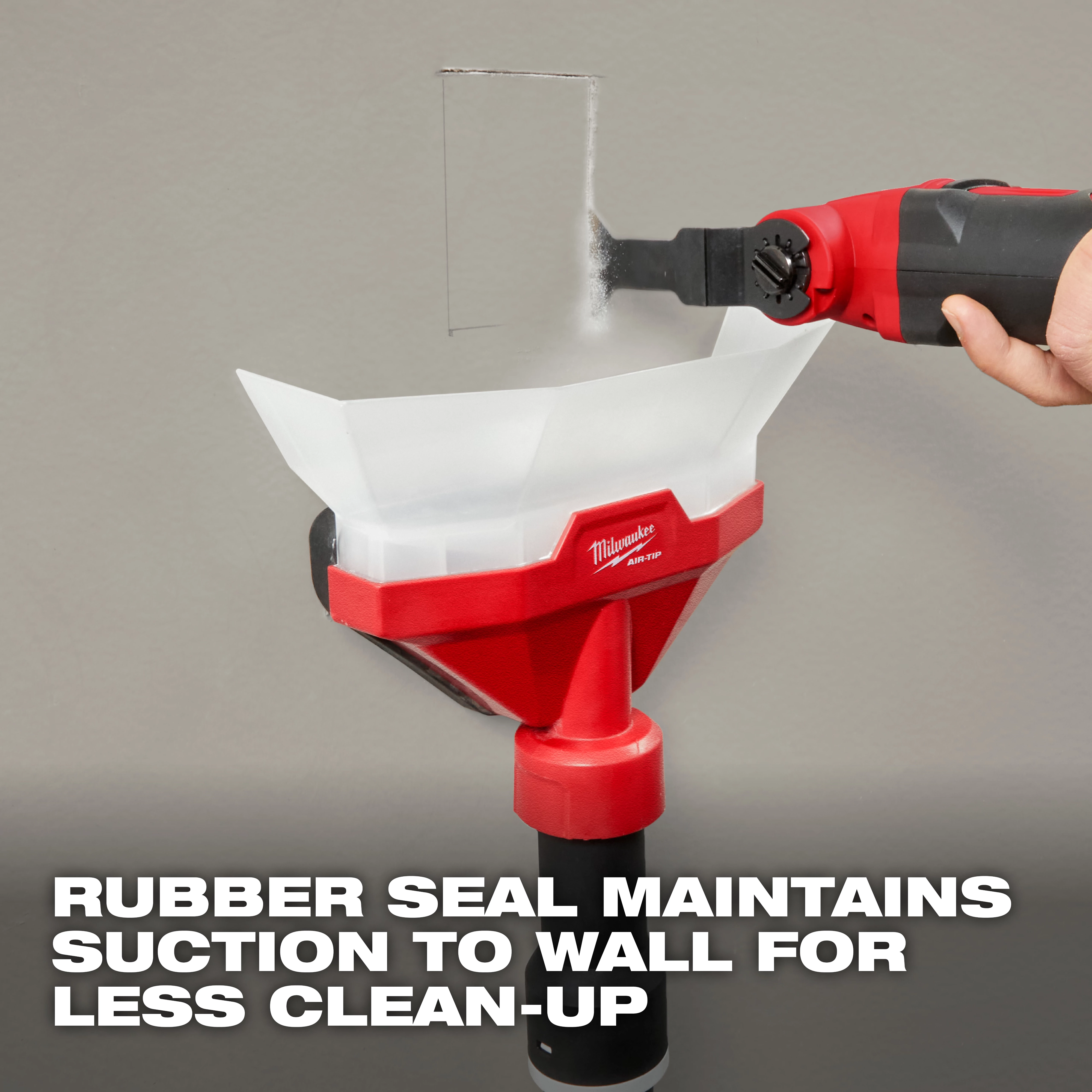 The image shows the AIR-TIP™ Dust Collector being used on a wall. It has a red and white design with a rubber seal that maintains suction to the wall, minimizing clean-up. The text at the bottom reads, "RUBBER SEAL MAINTAINS SUCTION TO WALL FOR LESS CLEAN-UP."