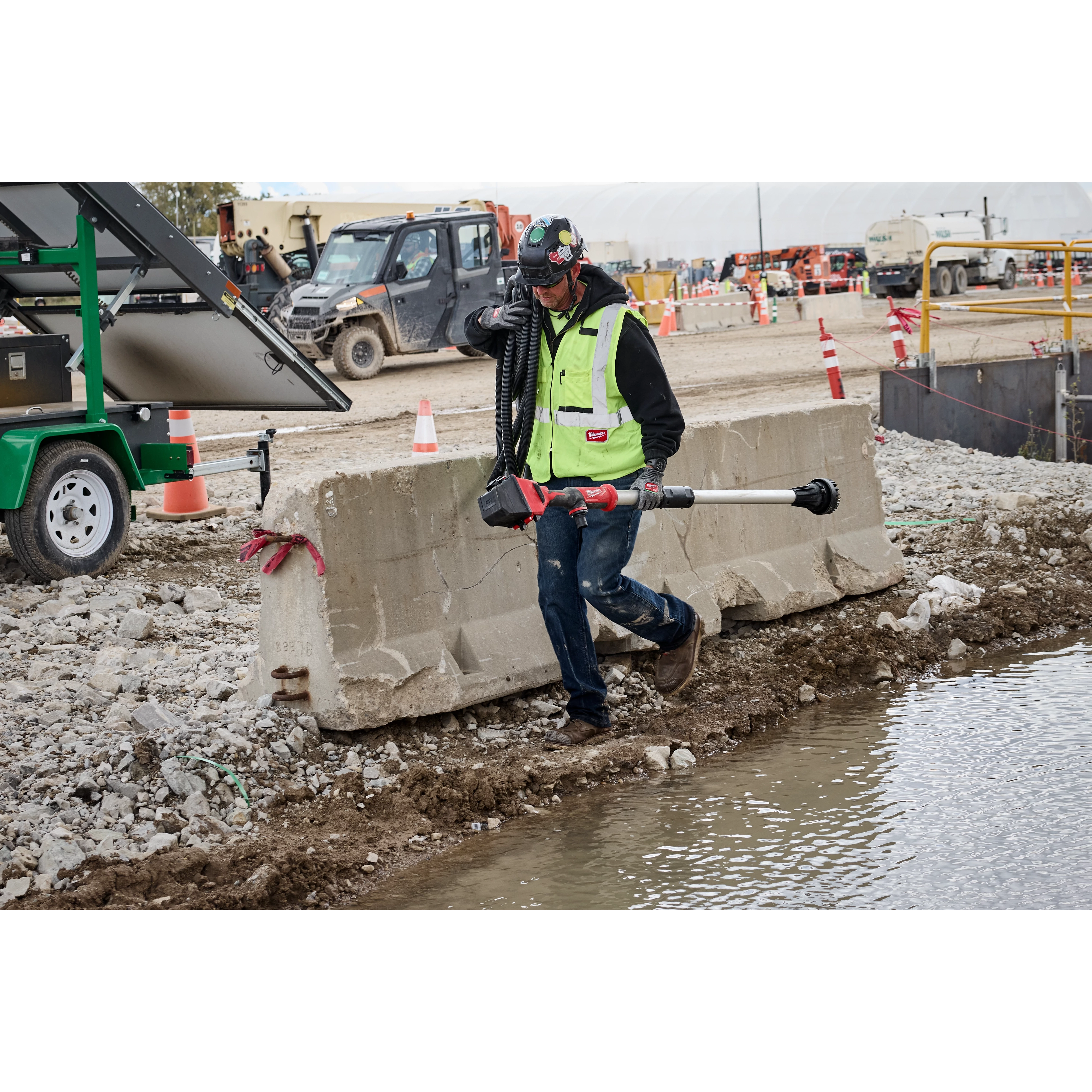 Image of the M18™ Brushless Stick Transfer Pump being used on a construction jobsite